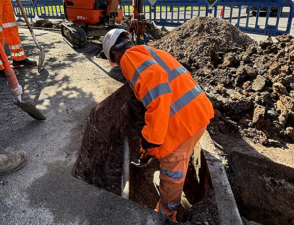 Employee working on site excavations